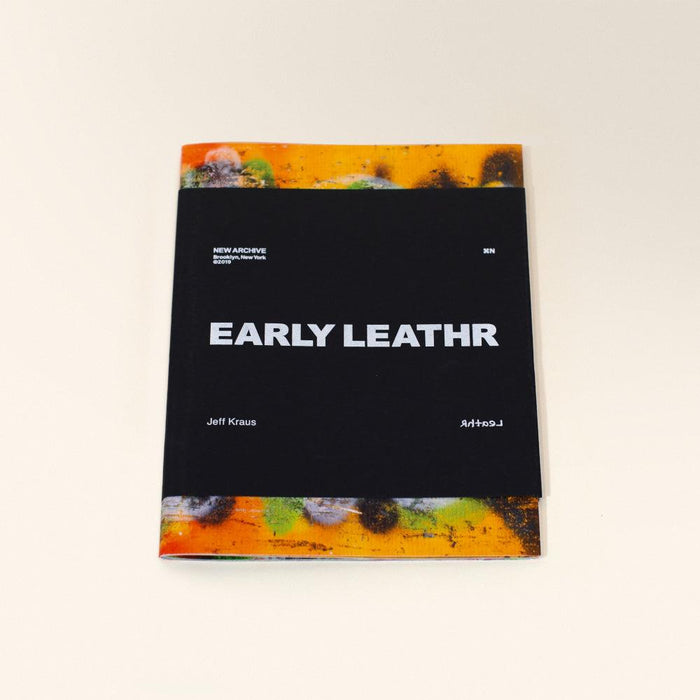 A black book titled EARLY LEATHR with white text featuring vibrant orange yellow and green abstract art on edges