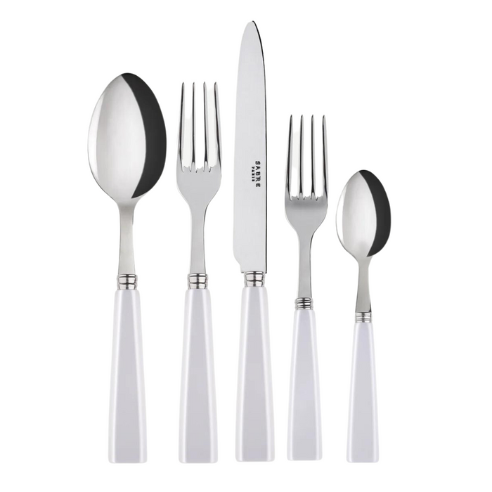 The Sabre Icone Flatware 5 Piece Setting features 18/10 stainless steel utensils with white handles, including a large spoon, dinner fork, knife, salad fork, and small spoon arranged side by side on a white background.