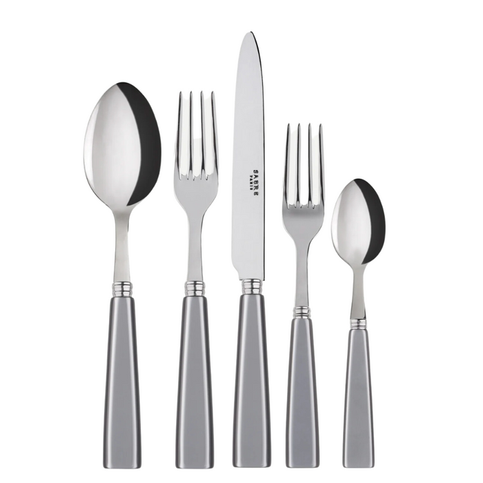 The Sabre Icone Flatware 5 Piece Setting includes a soup spoon, dinner fork, dinner knife, salad fork, and teaspoon with silver handles—crafted from 18/10 stainless steel and arranged side by side.