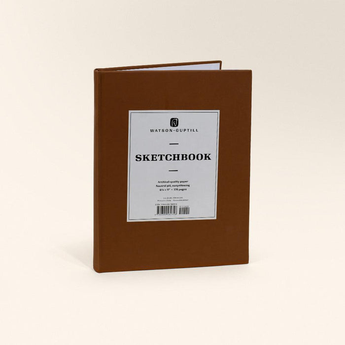Large sketchbook with a chestnut brown cover standing upright with a white Sketchbook label