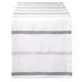 The Bodrum Metallic Band Silver Table Runner features a sleek, minimalist design with metallic silver bands, elegantly draped over the edge of a table.