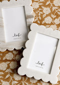 Scalloped marble picture frames showing variation possibilities in marble.