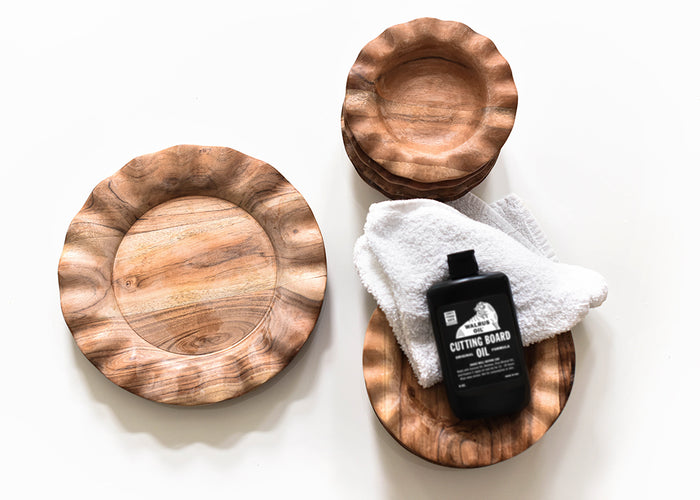 Overhead View of Wood Treatment Oil Bottle and Cloth Placed with Fundamentals Wood Collection